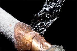 Water damage restoration services including repairing frozen pipes