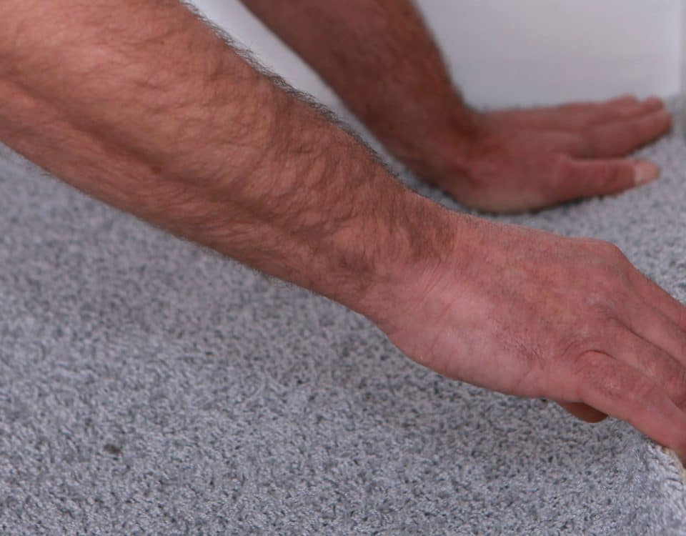 Man installing carpet