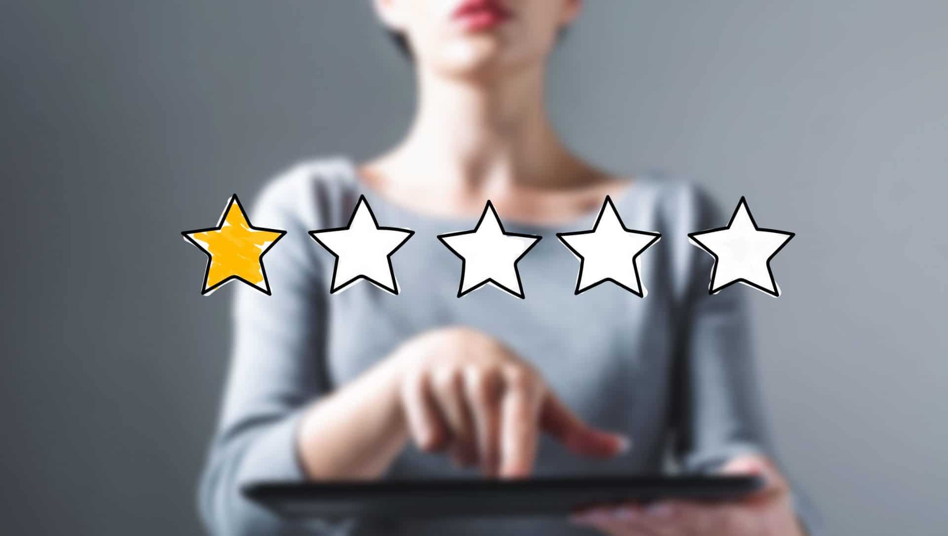 One star rating with business woman using a tablet computer