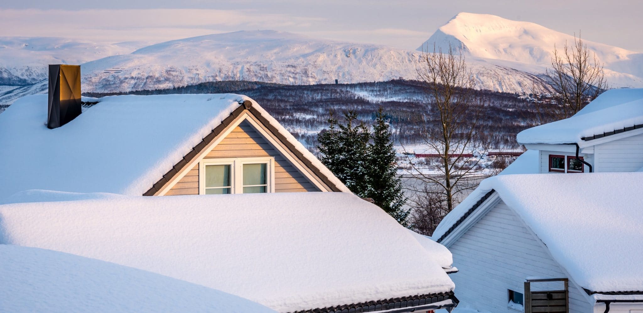 Homes with snow covered roofs