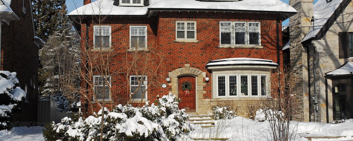 Exterior of a home with snow in the yard