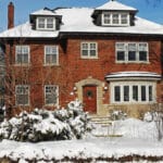 Exterior of a home with snow in the yard
