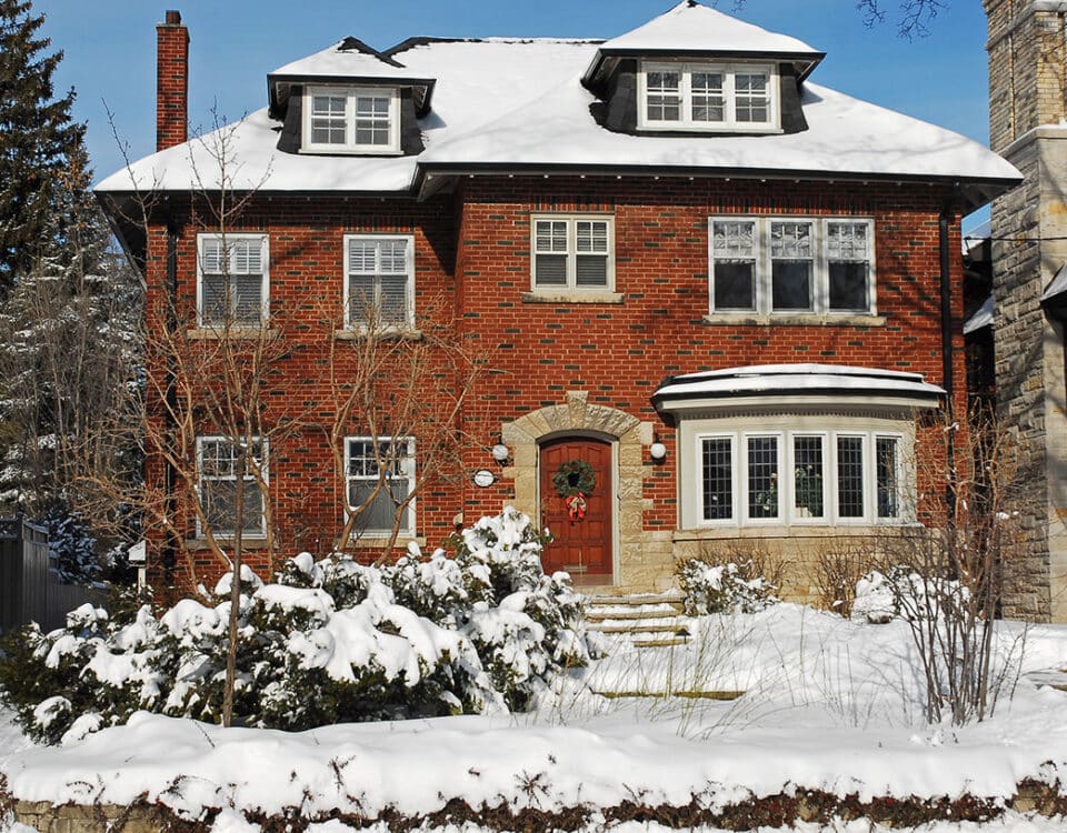 Exterior of a home with snow in the yard