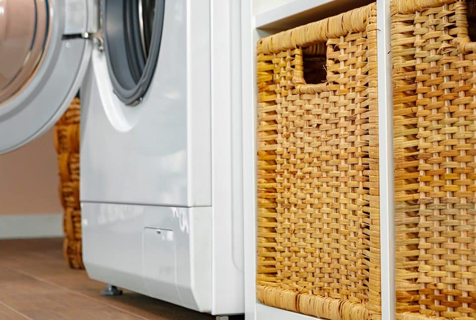 Washer and baskets in a laundry room