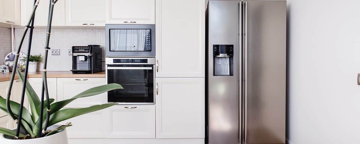 Kitchen with refrigerator, table and counter tops