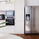 Kitchen with refrigerator, table and counter tops