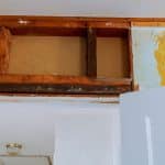 View of a wall of a home with drywall removed for repairs