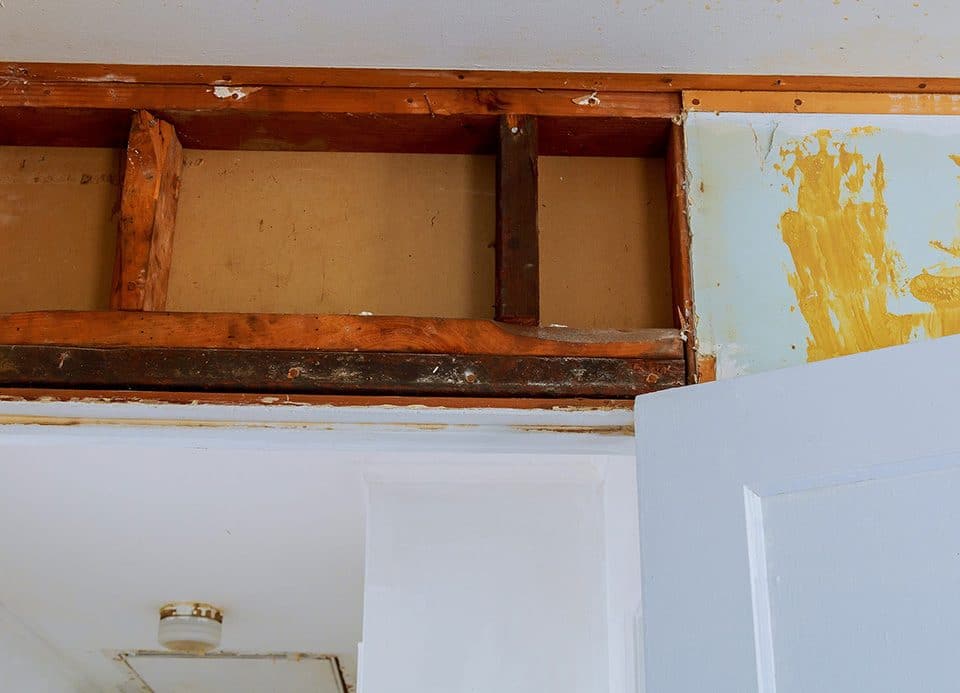 View of a wall of a home with drywall removed for repairs